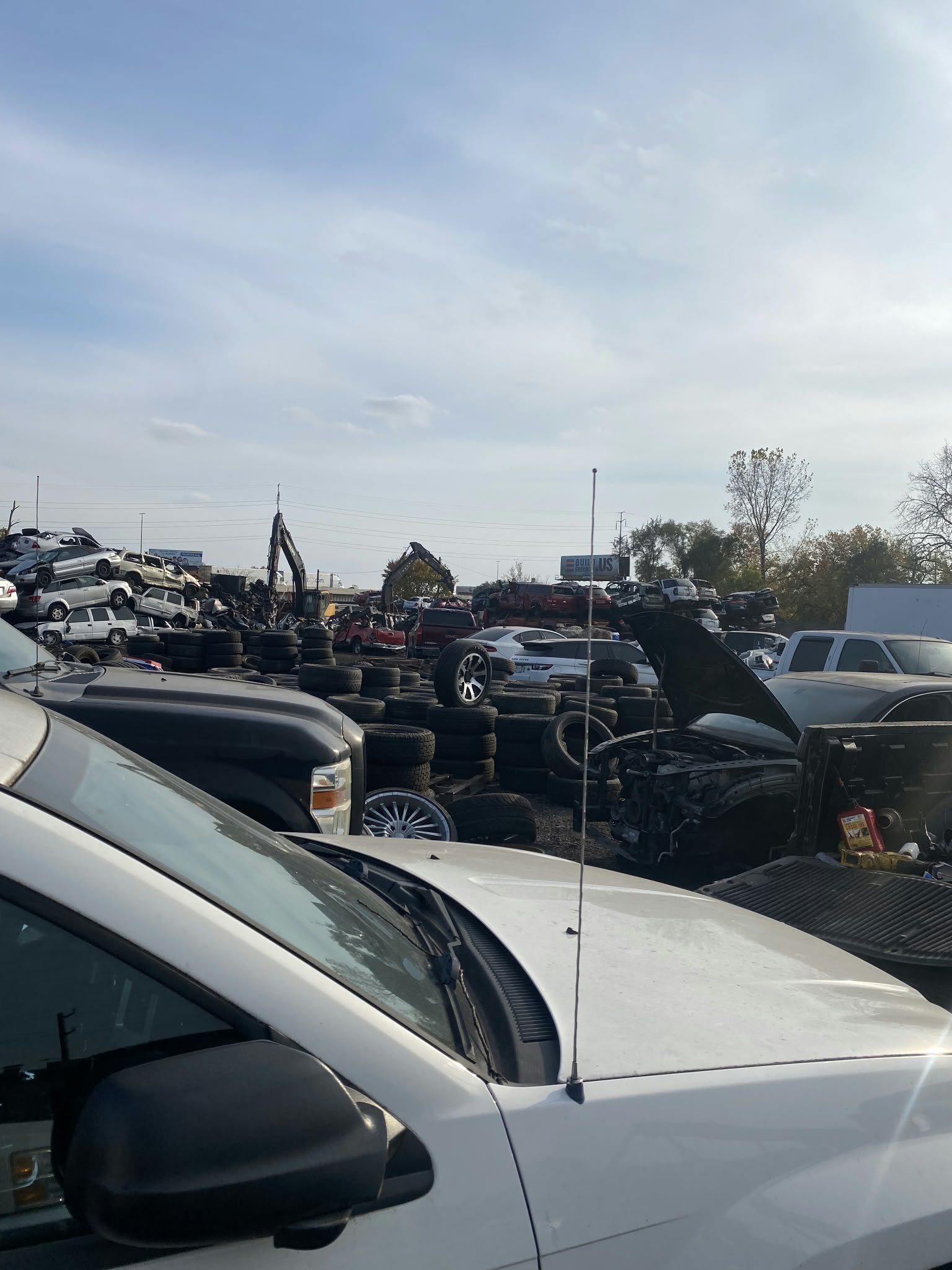 Unwanted vehicles and tires at a salvage yard